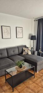 a living room with a couch and a coffee table at Albatros Tenerife Golf Sea View in San Miguel de Abona