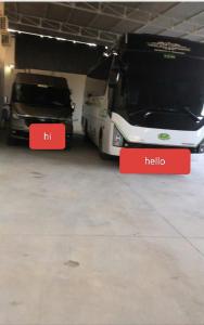 two trucks parked in a garage next to each other at Thanh Phước Hotel in Ấp Thanh Ðông +9 photos