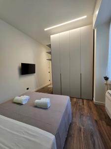 Ένα ή περισσότερα κρεβάτια σε δωμάτιο στο VeronaVera Orlandi