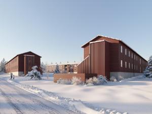 a couple of buildings in the snow at Forenom Hostel Ylläs in Kolari