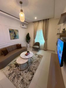 Μια τηλεόραση ή/και κέντρο ψυχαγωγίας στο Sweet Homes Apartment