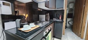 a kitchen with a counter top with mugs on it at Le Casablanca in Maarif