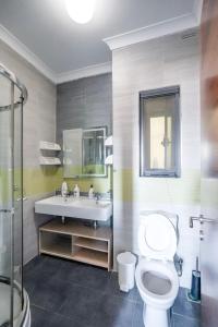 a bathroom with a toilet and a sink at Spacious Seafront 3-Bedroom Apartment in Sliema SV 3 in Sliema