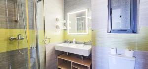 a bathroom with a sink and a toilet and a shower at Spacious Seafront 3-Bedroom Apartment in Sliema SV 3 in Sliema +28 photos