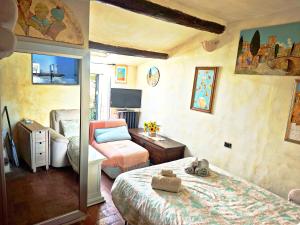 Postel nebo postele na pokoji v ubytování Nido d'amore Fiesole