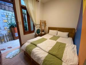 Postel nebo postele na pokoji v ubytování Mây Nhà Tuii - Homestay in Da Lat + 45 fotografií
