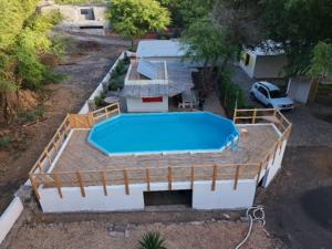 an overhead view of a large swimming pool on a house at Casa Madeira in Porto Novo
