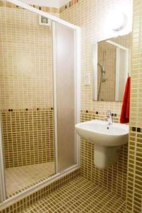 a bathroom with a sink and a shower at Paradise Apartment in Protaras +14 photos