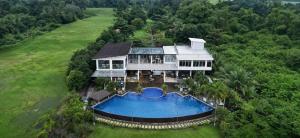 an aerial view of a house with a swimming pool at Vistapaloma beach resort in Odiong