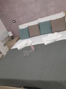 a bedroom with a bed with a pair of scissors on it at La Dimora Di Bruna in Naples