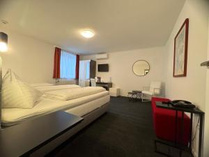 Ένα ή περισσότερα κρεβάτια σε δωμάτιο στο Hotel Altmann
