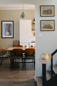 a dining room with a table and chairs at Maison Eudoise, piscine et spa in Eu