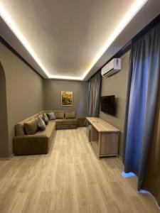 a living room with a couch and a table at RS Hôtel Karam Resort in Ouarzazate