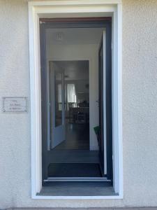 a doorway into a house with a door leading into a room at Gîte Aux Portes de Bellevue in Salbris