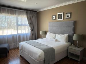 a bedroom with a large bed and a window at 23 on Camden Road Guesthouse in East London