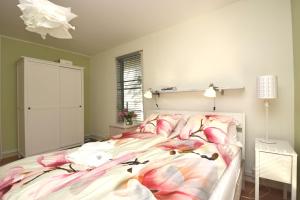 a bedroom with a bed and a dresser at Bright Home in Tallinn