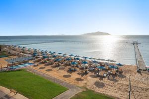 an aerial view of a beach with umbrellas and the ocean at Pickalbatros Palace Sharm - "Aqua Park" in Sharm El Sheikh