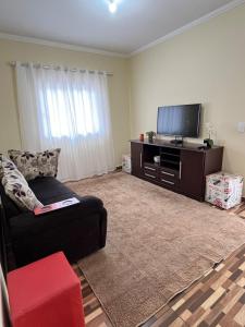 Et tv og/eller underholdning på Apartmento - Poços de Caldas