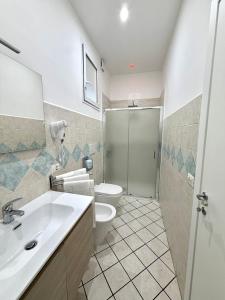a bathroom with a sink and a toilet and a shower at Dolci Momenti in Gragnano
