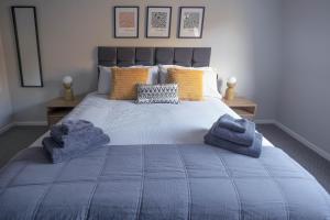 En eller flere senge i et værelse på Park View apartment, Gleneagles Village, Auchterarder