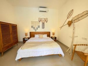 Cama o camas de una habitación en Villa Nala - Uluwatu Nusa Dua
