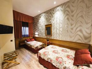 Postel nebo postele na pokoji v ubytování Hostal Hispano - Argentino Gran Vía