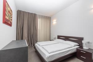 Ένα ή περισσότερα κρεβάτια σε δωμάτιο στο Appartamenti Torre del Capitano