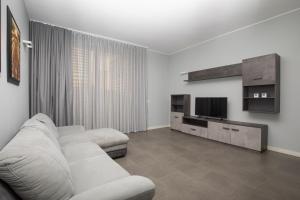 Μια τηλεόραση ή/και κέντρο ψυχαγωγίας στο Appartamenti Torre del Capitano