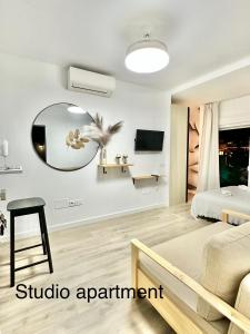 a bedroom with a bed and a mirror at Higueron apartment in Resort next Luxury SPA in Fuengirola