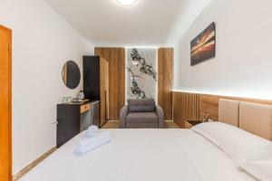 Ένα ή περισσότερα κρεβάτια σε δωμάτιο στο Hotel Riti