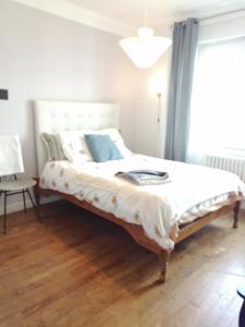 Ένα ή περισσότερα κρεβάτια σε δωμάτιο στο Respire