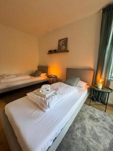 Postel nebo postele na pokoji v ubytování Bavaria Home Apartments Geisenfeld