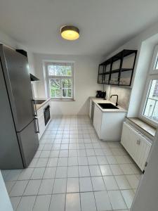 Kuchyň nebo kuchyňský kout v ubytování Bavaria Home Apartments Geisenfeld + 10 fotografií