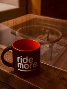 a red coffee cup sitting on a glass table at Nara IROHA in Nara +4 photos