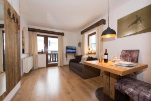 a living room with a table and a couch at Angelas Appart in Ehrwald