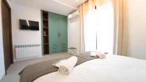 Ένα ή περισσότερα κρεβάτια σε δωμάτιο στο Aurora La Marsa 201 – Modernité Charme