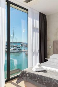 Posteľ alebo postele v izbe v ubytovaní Marina Baotić Apartments + 59 fotografií