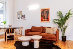 a living room with a couch and a table at Berlin & Friends in Berlin