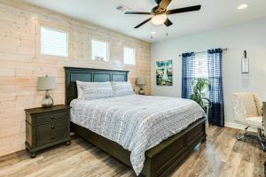 a bedroom with a bed and a ceiling fan at Prime Steps to Beach Large Deck Pet Friendly in Stingaree