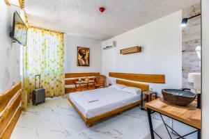 a bedroom with a bed and a sink at Art Hotel Simona in Sofia +43 photos