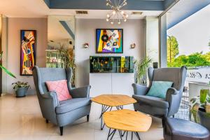 a waiting room with two chairs and a table at Art Hotel Simona in Sofia