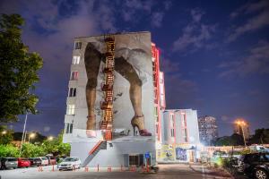 a building with a large painting on the side of it at Art Hotel Simona in Sofia