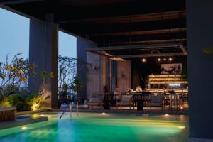 a resort with a swimming pool and a restaurant at Shō Hotel Penang in George Town +83 photos