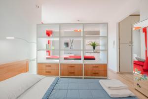 a bedroom with a bed and a large glass wall at Cervino's Home - 20 min from Venice & Parking in Venice