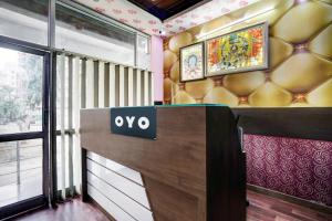 a lobby with an ovo sign on a wall at Super Hotel O Rudra palace in Jaipur