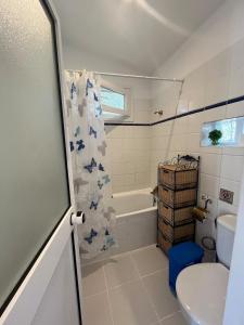 a bathroom with a toilet and a tub and a sink at Malaka in Coín +38 photos