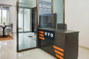 a desk with a sign on it in a room at Hotel O EKAB Hospitality in Mundhwa