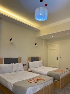 Postel nebo postele na pokoji v ubytování La casa hotel