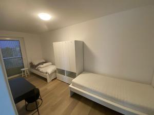 Postel nebo postele na pokoji v ubytování Quartiercenter Wohnung 1