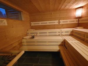 a sauna with a sink in a wooden cabin at Bergwiesenalm in Buntenbock +24 photos